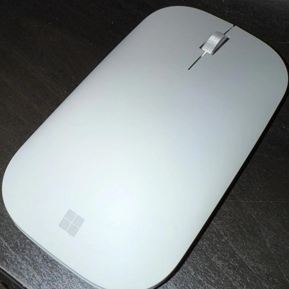 The Microsoft light grey wireless mouse